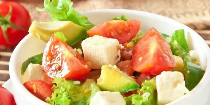 Light salad with tomatoes, herbs and avocado