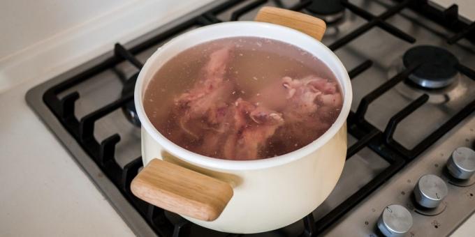 How to cook chicken broth: Put the chicken in the pan and cover with water
