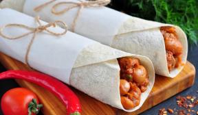 Burrito with chicken, beans and tomatoes