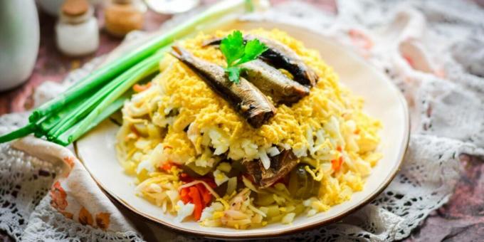 Layered salad with sprats, eggs and vegetables