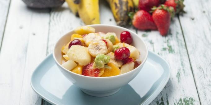 Fruit salad with avocado, grapes and tangerines