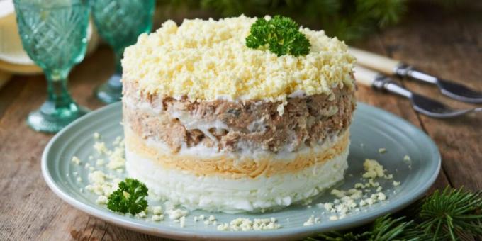 Salad with canned fish, cheese and eggs